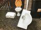 Bathroom White China Toilet And Vanity Sink In Good Condition