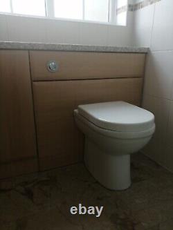 L' Shaped bathroom suite, basin, concealed cistern toilet and shower enclosure