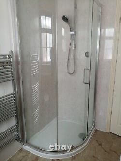 L' Shaped bathroom suite, basin, concealed cistern toilet and shower enclosure