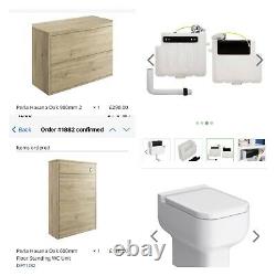 Oak bathroom vanity unit with back to wall toilet with concealed cistern