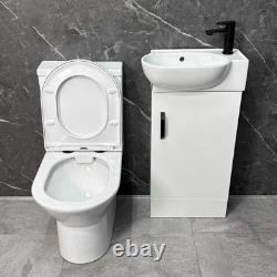 Ensemble de salle de bains, meuble sous-vasque blanc, poignée noire et dos ouvert pour toilettes