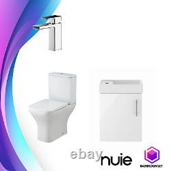 Ensemble de salle de bains moderne avec unité de vanité blanche, toilette adossée au mur et lavabo.
