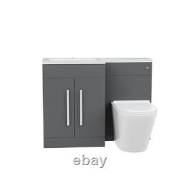 Unité de meuble lavabo Nes Home 1100mm LH en gris mat et toilettes sans bride à poser contre le mur.